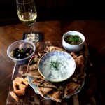 Tapas with Cucumber Raita, Baba Ganoush, Mixed Olives, Grilled Herbed Flatbread, and Aged Gouda